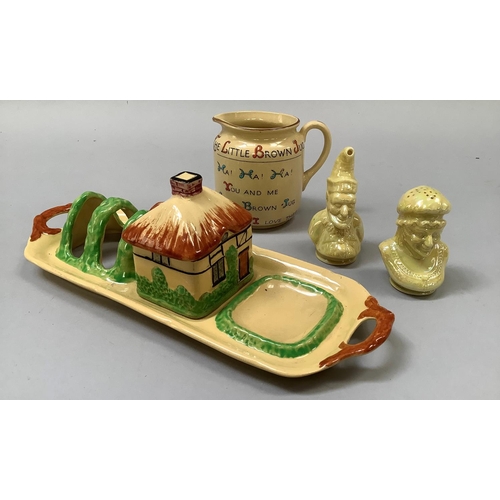 352 - A W. H. Goss Royal Buff, 'The Little Brown Jug', 7.5cm high, a yellow lustre glazed Punch and Judy c... 