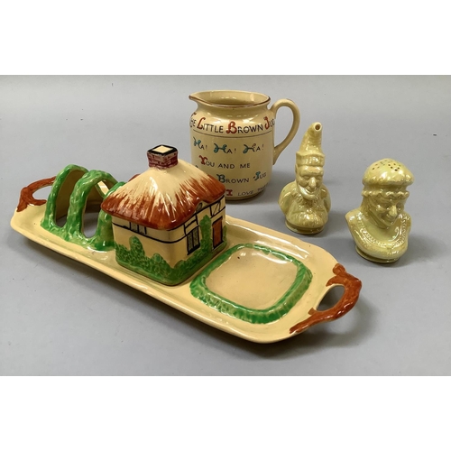 352 - A W. H. Goss Royal Buff, 'The Little Brown Jug', 7.5cm high, a yellow lustre glazed Punch and Judy c... 