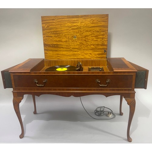 55 - A Dynatron Radiogram with Garrard turntable and concealed extending speakers, in walnut cabinet with... 