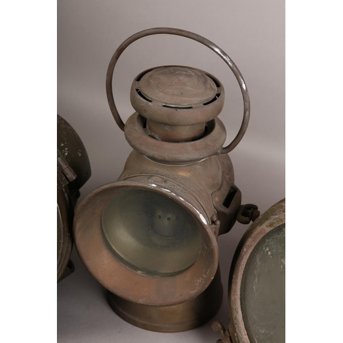 144 - A pair of Miller military transport acetylene headlights with ordnance benchmark, together with a Lu... 