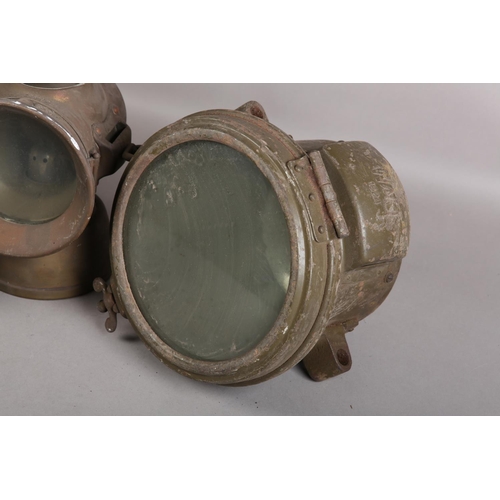 144 - A pair of Miller military transport acetylene headlights with ordnance benchmark, together with a Lu... 