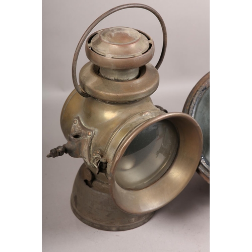 151 - A Miller military acetylene headlight with intact 17cm lens, reflector and focusing burner assembly,... 