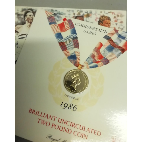 212 - Two Commonwealth Games commemorative £2 coins 1986 in Royal Mint folders, 2007 diamond wedding crown... 