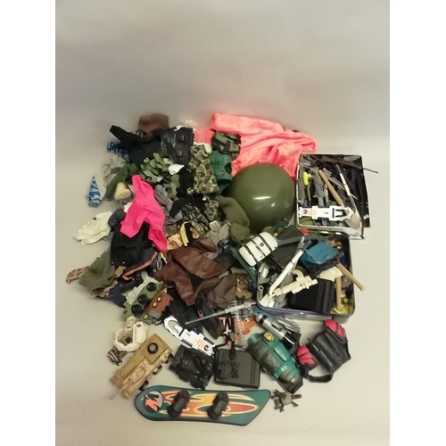 252 - A large quantity of Action Man clothing and accessories, jackets, hats, gloves, boots, shoes, guns, ... 