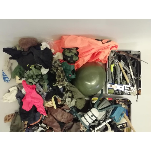 252 - A large quantity of Action Man clothing and accessories, jackets, hats, gloves, boots, shoes, guns, ... 