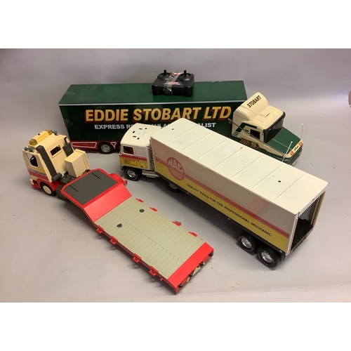 299 - Three large model trucks, including a radio controlled Eddie Stobart HGV, a NYLINT Corp Mac Tools Ju... 