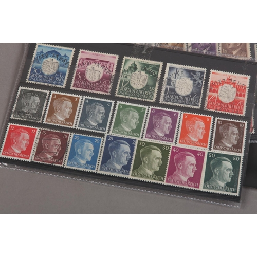 376 - Plastic folder with large collection of unused mint Hitler related postage stamps plus a collection ... 