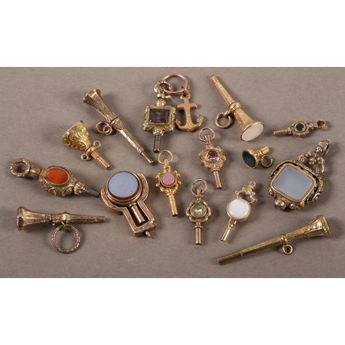 443 - A COLLECTION OF VICTORIAN POCKET WATCH KEYS  in rolled gold variously set with agate, cornelian, sar... 