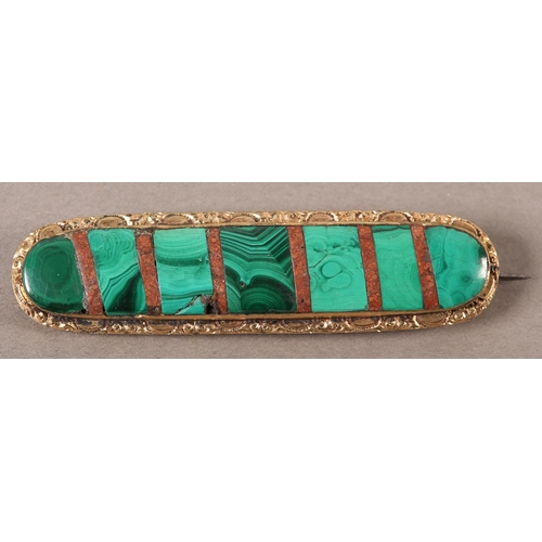 410 - A VICTORIAN MALACHITE BROOCH, collet set within an elongated oval interspaced with strips of red aga... 