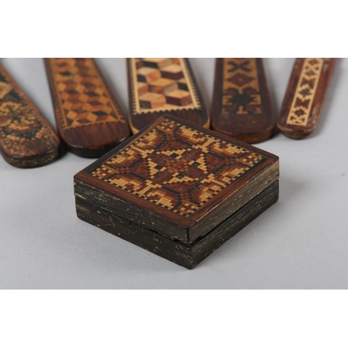 54 - FOUR VICTORIAN TUNBRIDGE WARE PAGE TURNERS,  24.5cm maximum, a book mark and a small box, 4.5cm squa... 