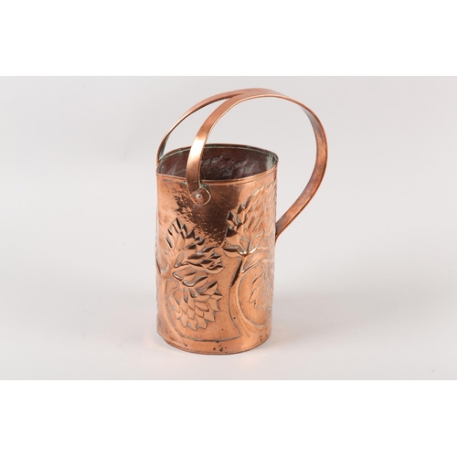 34 - AN ARTS AND CRAFTS COPPER INDOOR WATERING CAN, cylindrical, the rim nipped to create a pouring lip, ... 