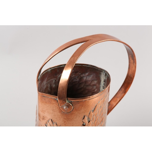 34 - AN ARTS AND CRAFTS COPPER INDOOR WATERING CAN, cylindrical, the rim nipped to create a pouring lip, ... 