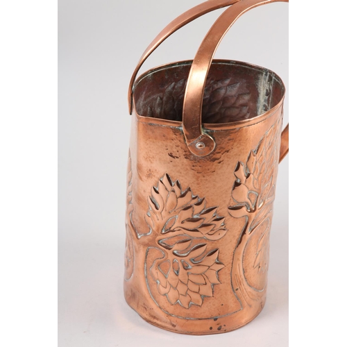 34 - AN ARTS AND CRAFTS COPPER INDOOR WATERING CAN, cylindrical, the rim nipped to create a pouring lip, ... 