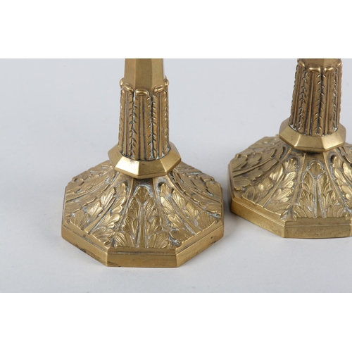 35 - A PAIR OF ORMOLU CANDLESTICKS, octagonal having beaded sconce and stiff leaf collars to the stem and... 