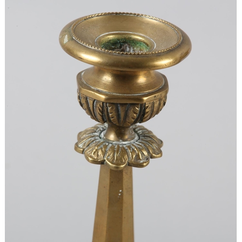 35 - A PAIR OF ORMOLU CANDLESTICKS, octagonal having beaded sconce and stiff leaf collars to the stem and... 