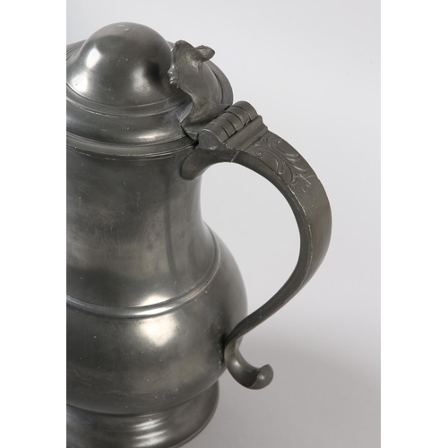 39 - A LARGE PEWTER LIDDED SERVING JUG FOR BEER, of baluster form, the lid with acanthus thumb piece, 'S'... 