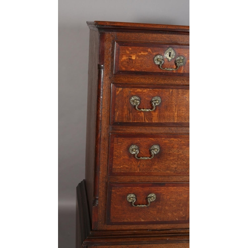 565 - AN 18TH CENTURY OAK AND MAHOGANY BANDED CHEST ON CHEST, having two short over three graduated drawer... 