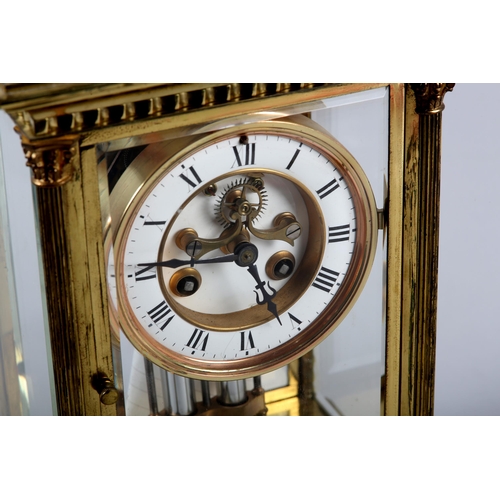 86 - A LATE 19TH CENTURY FRENCH FOUR LIGHT STRIKE CLOCK in a brass columned case, the four bevelled glass... 