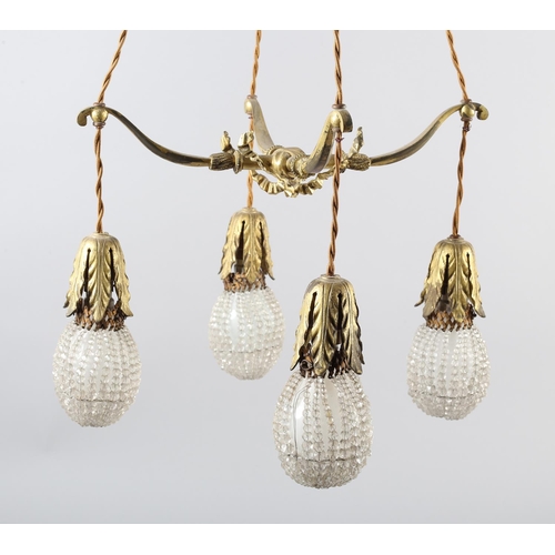 2 - A PAIR OF EARLY 20TH CENTURY FRENCH GILDED BRASS PENDANT LIGHT FITTINGS, each cast as two crossed bo... 