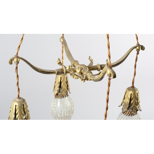 2 - A PAIR OF EARLY 20TH CENTURY FRENCH GILDED BRASS PENDANT LIGHT FITTINGS, each cast as two crossed bo... 