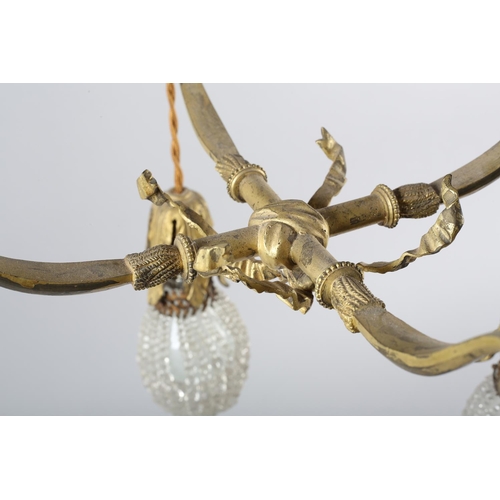 2 - A PAIR OF EARLY 20TH CENTURY FRENCH GILDED BRASS PENDANT LIGHT FITTINGS, each cast as two crossed bo... 