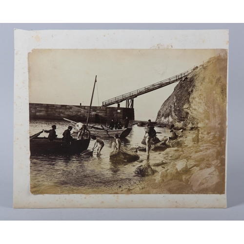 7 - FRANK MEADOW SUTCLIFFE (1853-1941), Young boys in bathing shorts helping to unload fishing boats bes... 