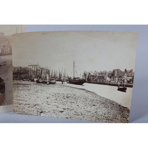 23 - FRANK MEADOW SUTCLIFFE (1853-1941), Whitby Harbour, low tide with moored fishing boats, titled and d... 