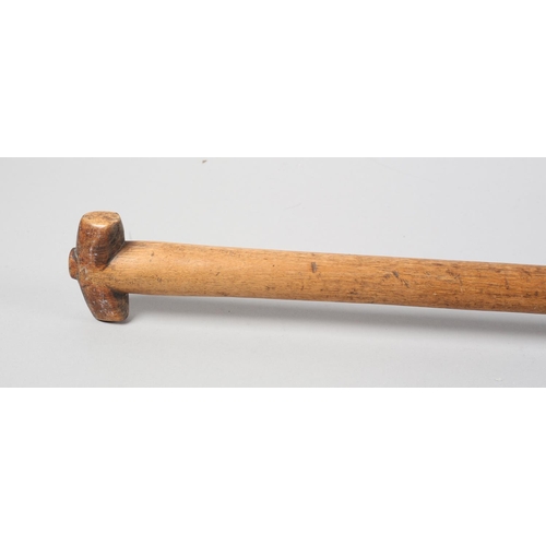 49 - A HARDWOOD STAFF, having a T shaped head, the shaft carved with a serrated and flattened oblong, lat... 