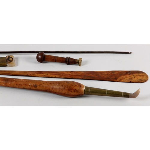 67 - A COLLECTION OF 19TH CENTURY HARDWOOD AND BRASS MOUNTED LEATHER WORKING TOOLS, two with agate heads,... 