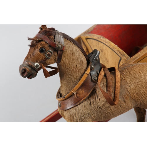 71 - A VICTORIAN HAND MADE MODEL OF A PONY AND TRAP, the pony skin covered carved wooden horse with glass... 