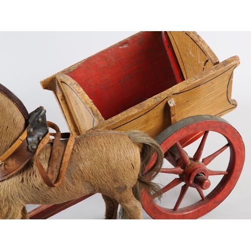 71 - A VICTORIAN HAND MADE MODEL OF A PONY AND TRAP, the pony skin covered carved wooden horse with glass... 