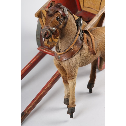 71 - A VICTORIAN HAND MADE MODEL OF A PONY AND TRAP, the pony skin covered carved wooden horse with glass... 