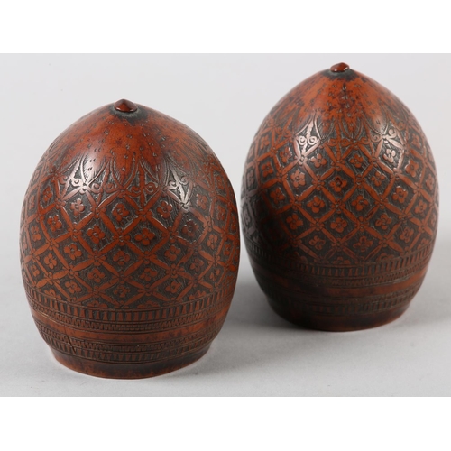 99 - A PAIR OF 18TH CENTURY CARVED AND POLISHED COCONUT SHELL CUPS, worked with a flower head filled trel... 