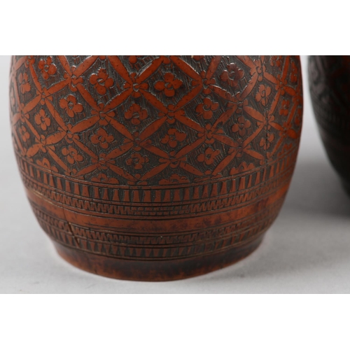 99 - A PAIR OF 18TH CENTURY CARVED AND POLISHED COCONUT SHELL CUPS, worked with a flower head filled trel... 