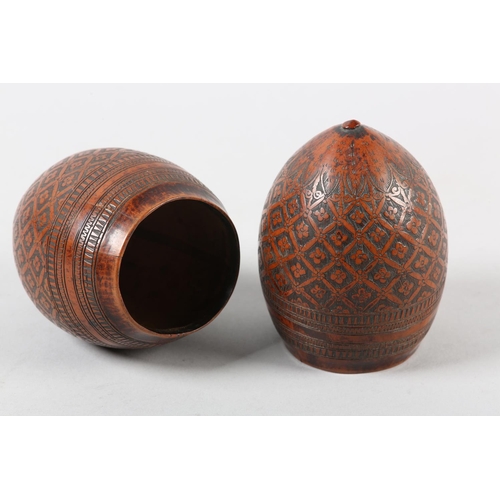 99 - A PAIR OF 18TH CENTURY CARVED AND POLISHED COCONUT SHELL CUPS, worked with a flower head filled trel... 