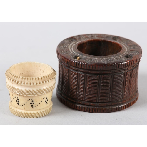 100 - A LATE 18TH/EARLY 19TH CENTURY TREEN INKWELL, of drum shape carved with vertical bands and milled ri... 