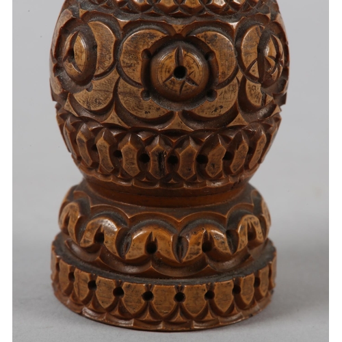 101 - A LATE 18TH/EARLY 19TH CENTURY CARVED FRUITWOOD PEPPERETTE of baluster form, 11.5cm high .....please... 