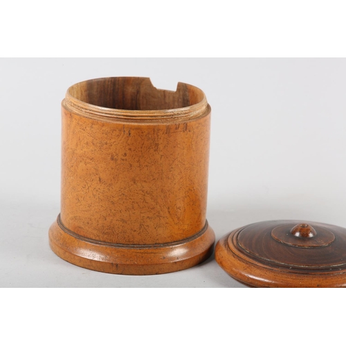 102 - A 19TH CENTURY LIGNUM VITAE turned string box of drum form, 13.5cm diameter x 16cm high