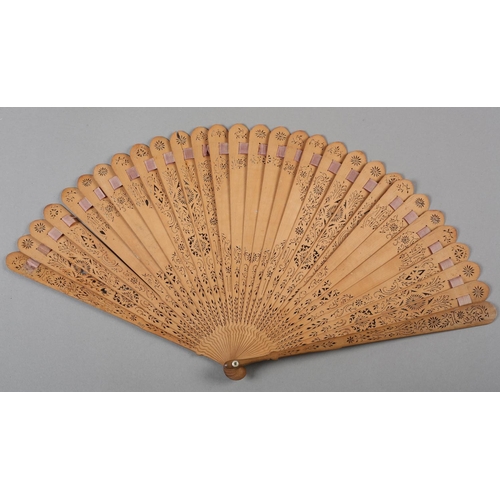 1 - Two late 18th century wood brisé fans, the first with 28 inner sticks and two guards, rounded tips, ... 