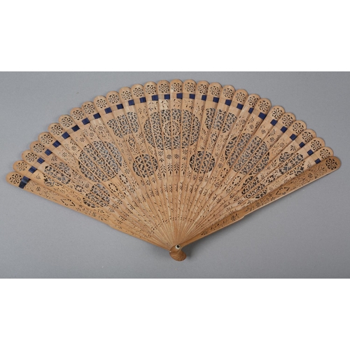 1 - Two late 18th century wood brisé fans, the first with 28 inner sticks and two guards, rounded tips, ... 