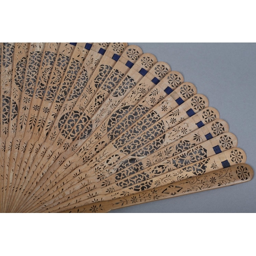 1 - Two late 18th century wood brisé fans, the first with 28 inner sticks and two guards, rounded tips, ... 