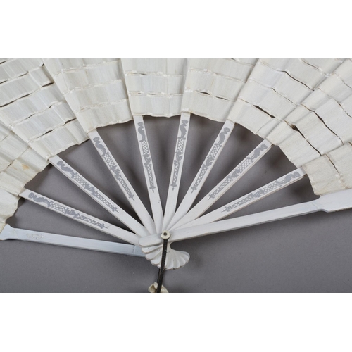 10 - A French silk “Trick” fan or eventail à dislocation, the complex bands of cream silk ribbon mounted ... 