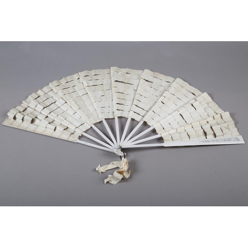 10 - A French silk “Trick” fan or eventail à dislocation, the complex bands of cream silk ribbon mounted ... 