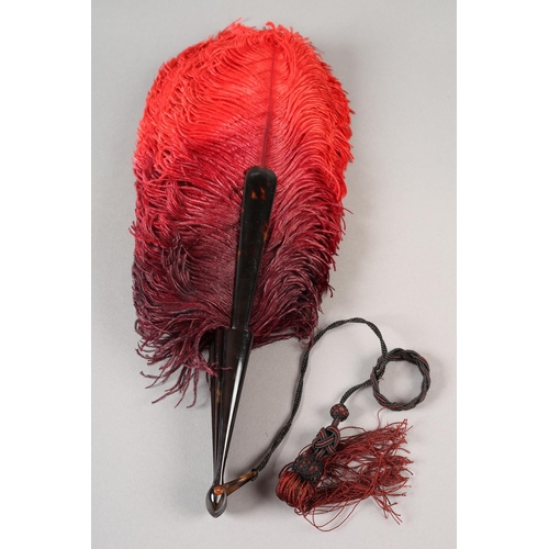 105B - c.1900, an ostrich feather fan, the plumes deep plum shaded to red, with tortoiseshell monture, the ... 