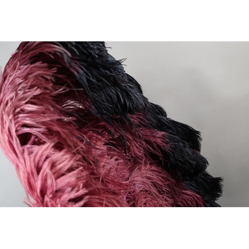 106 - Fan Dancing!  An ostrich feather fan, oversized, with deep plum plumes shading almost to black, with... 