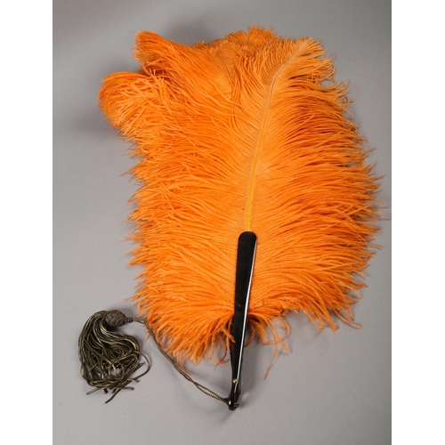 108 - 1920’s vibrant orange ostrich feather fan, large and showy, the monture of tortoiseshell, frothy fea... 