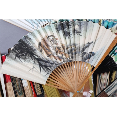 109 - A large selection of 20th century folding fans advertising airlines and other transport, to include ... 