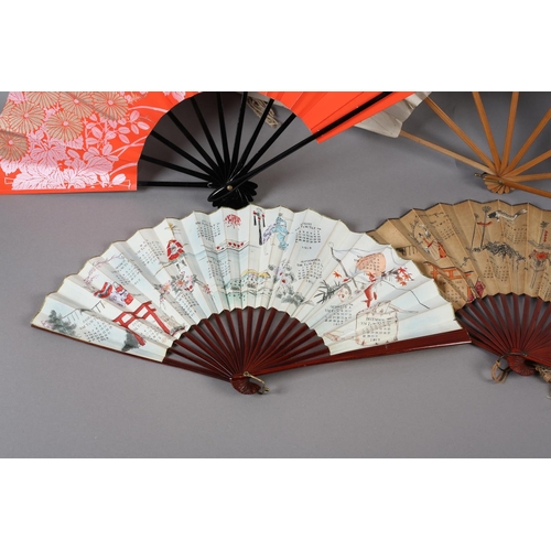 129 - Japan: Four Japanese fans to include a large folding fan with knotted cord decoration to both guards... 