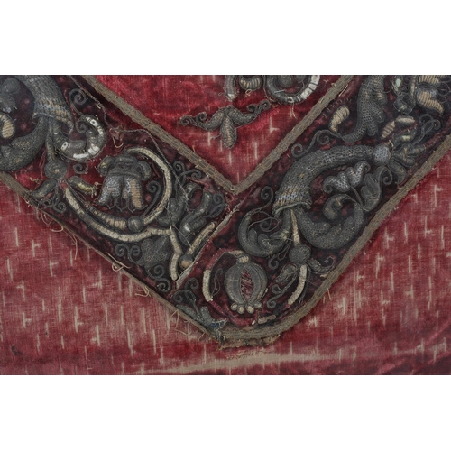 175 - A 17th century or earlier velvet panel embroidered in metal threads in relief, stumpwork, with cornu... 