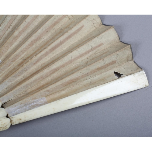 2 - An 18th century bone fan, the upper guards painted in chinoiserie fashion, the sticks carved as to b... 